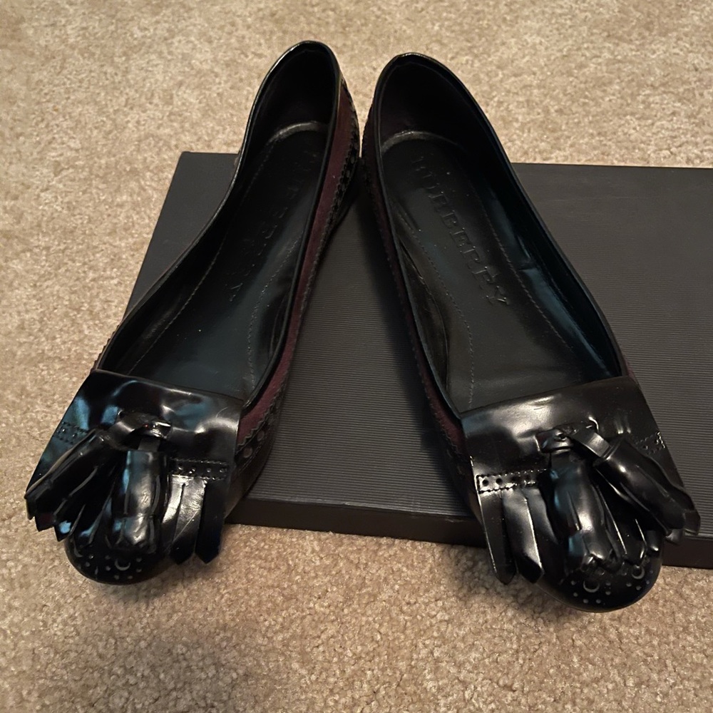 Maroon and black ballet flats with tassel detail